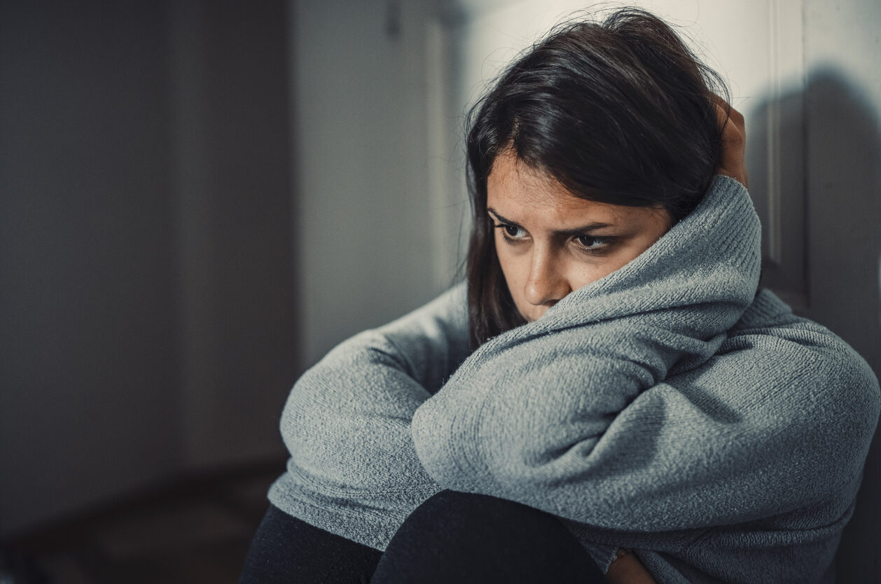 Close up of young woman struggling from mental breakdown - schizoaffective disorder