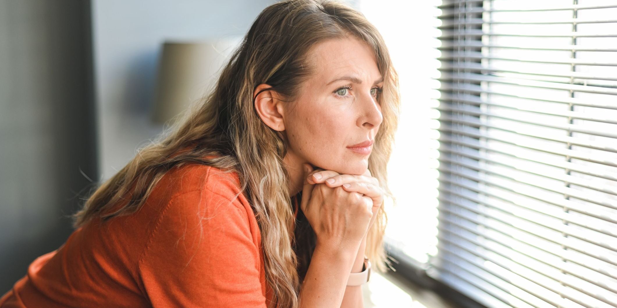 woman looking out of window