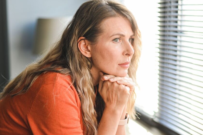 woman looking out of window