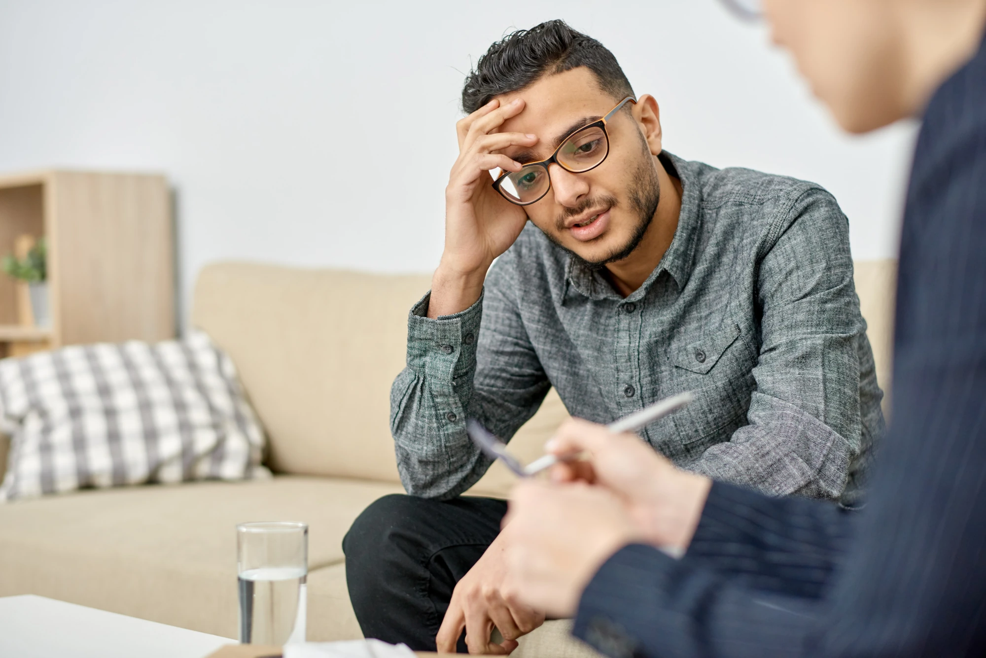 Adult patient discussing schizophrenia treatment options with a psychiatrist.