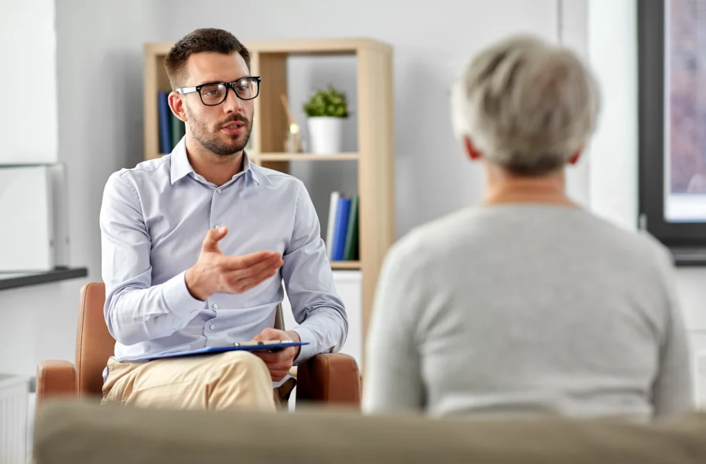 Mental health professional supporting a person with schizophrenia.
