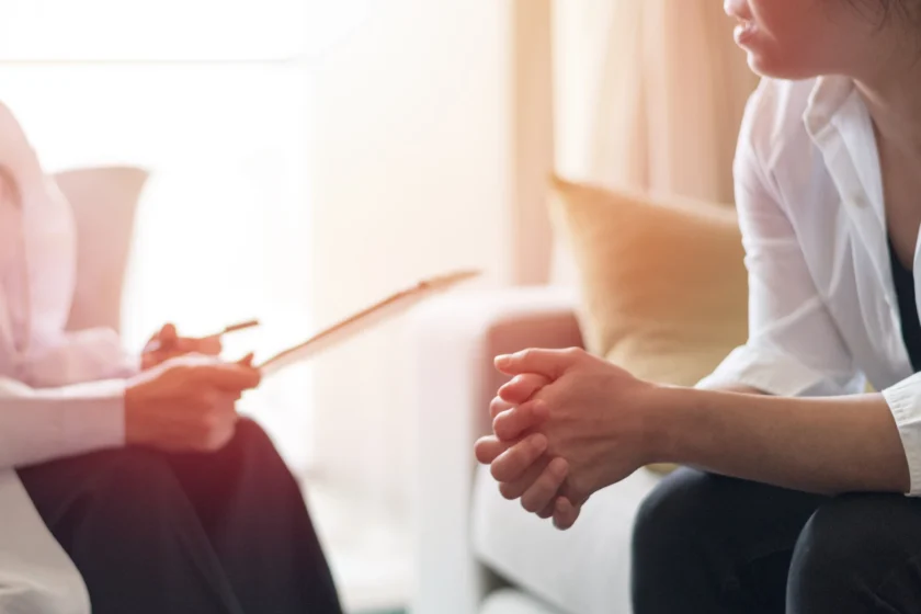 Psychiatrist talking with a patient about switching schizophrenia medications.