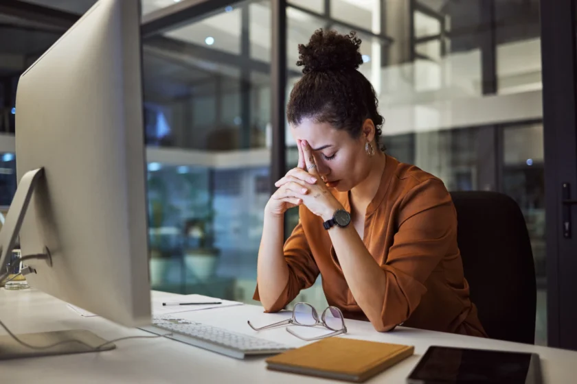 Tired woman sitting at a desk