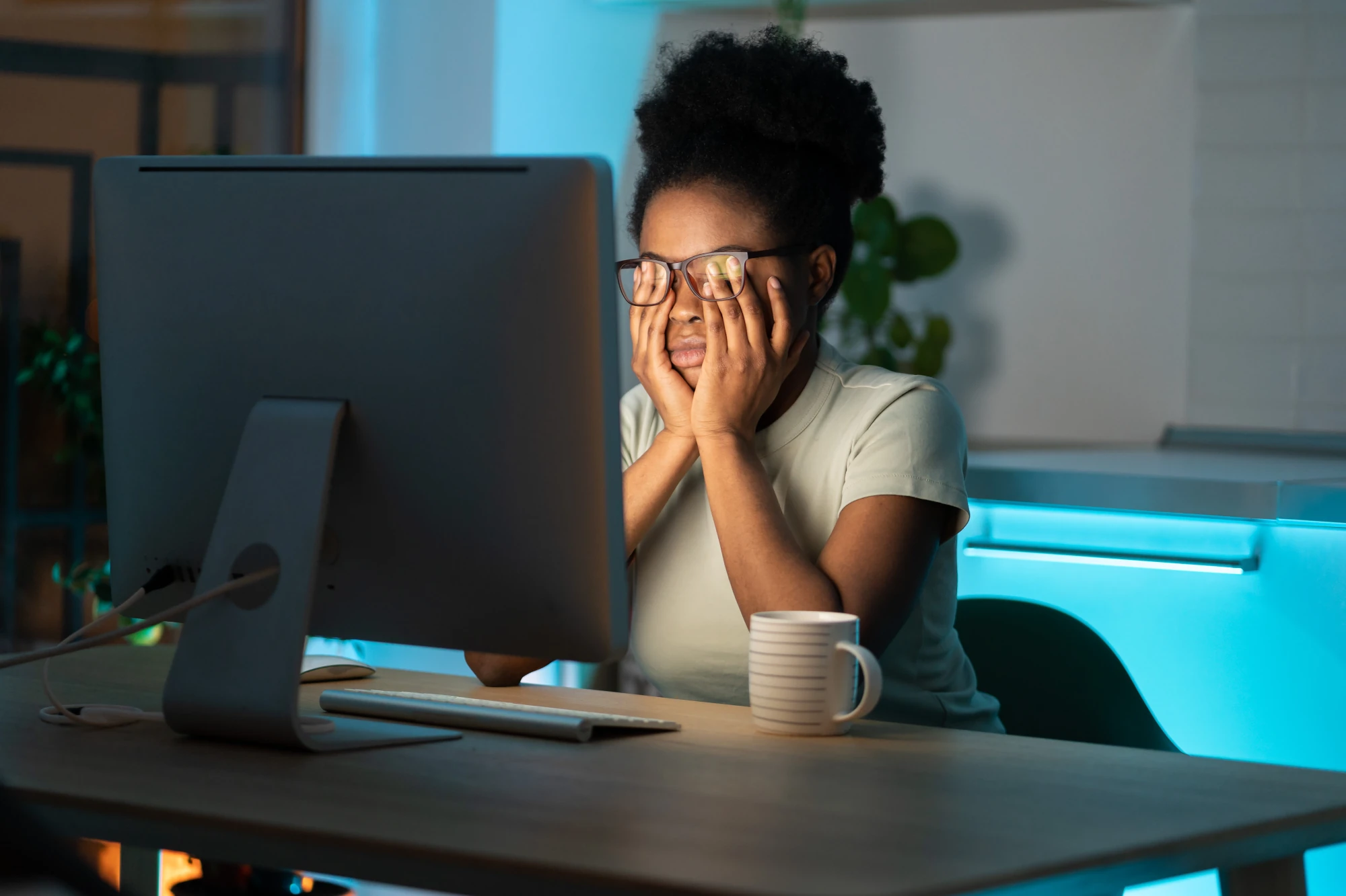 Tired woman sitting at a desk